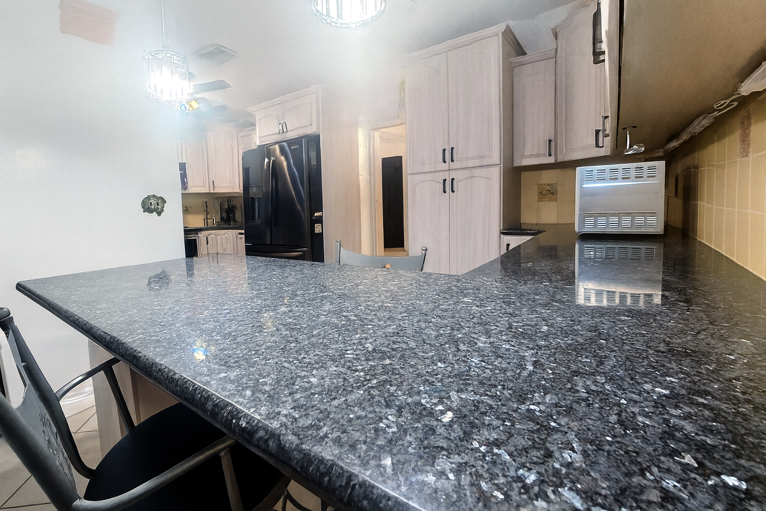 Kitchen view of appliances and prep areas